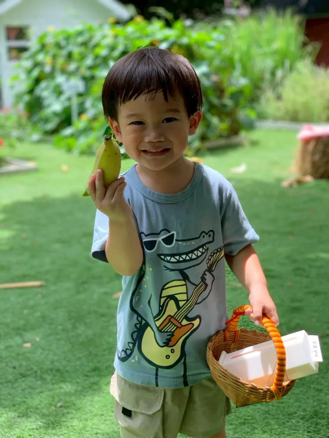 A boy heading home with a banana and his basket
