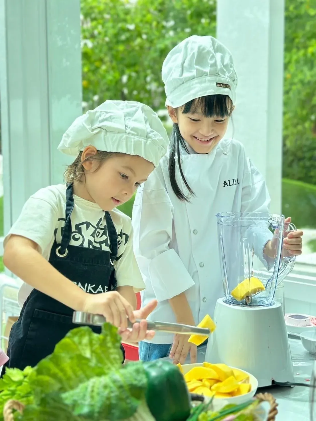 Children preparing food in the school kitchen
