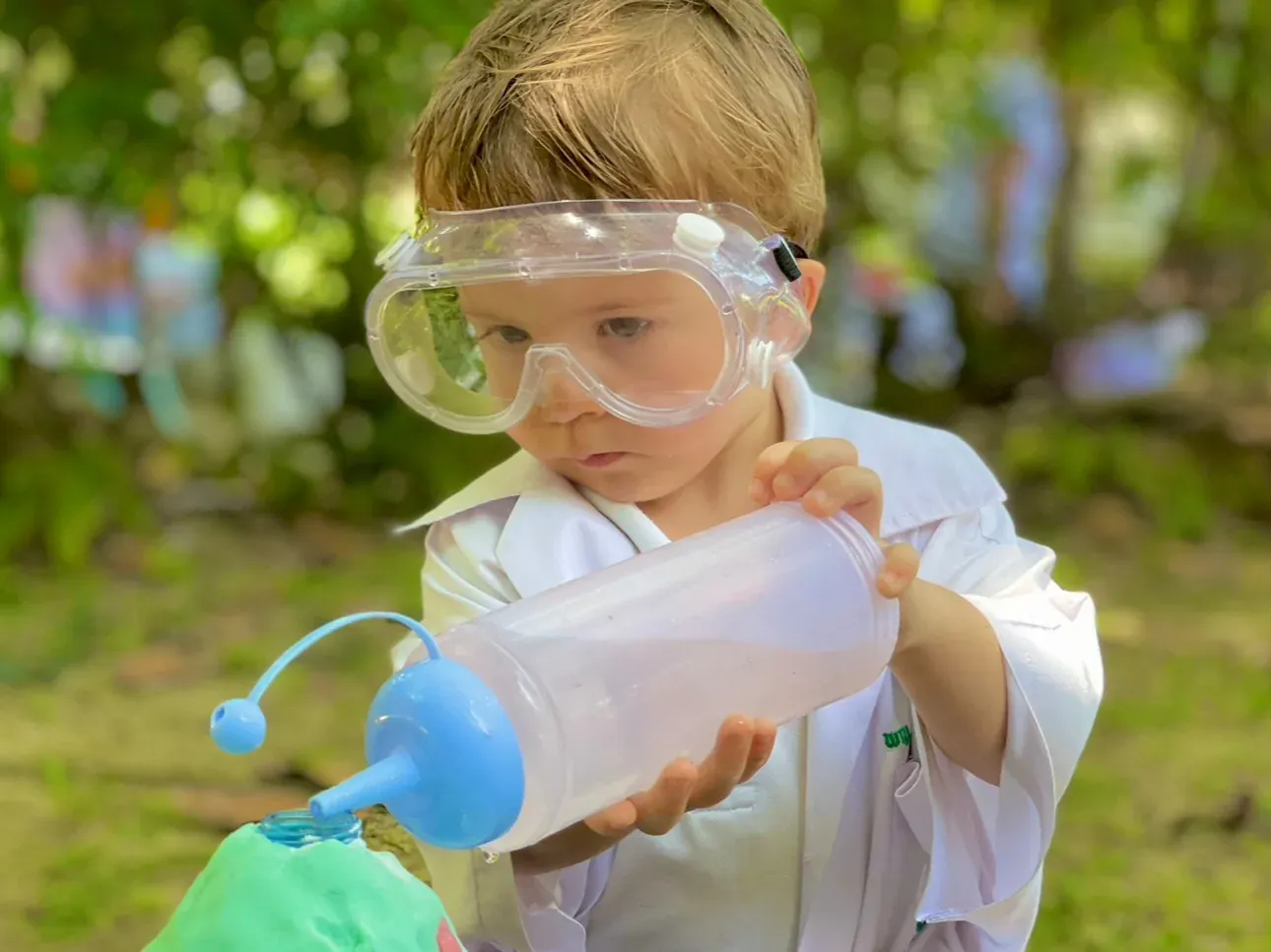 Children handling Montessori materials with their hands